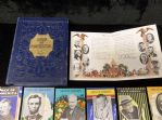 1928 The Stevens-Davis Co. “Men of America” (H572) Complete Factory Set of 52 Booklets (B. Jones, Landis, #35 American Athletics) with Presentation Paper in Original Box